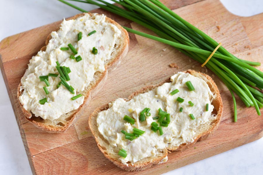 Smoked trout spread with eggs and cream cheese on a piece of bread
