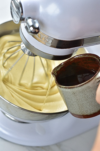 oil is being added to the eggs-sugar mixture