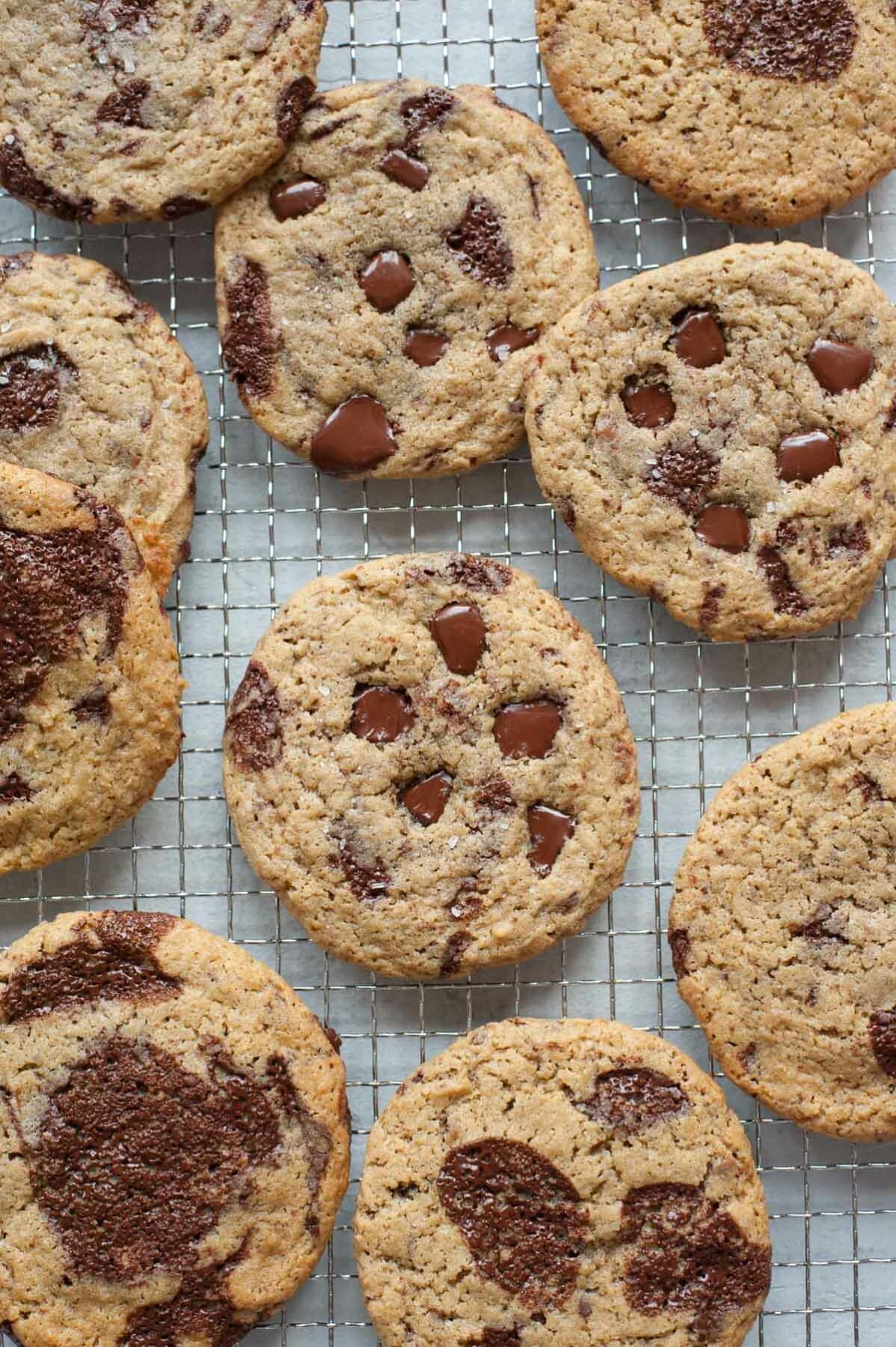 Rye chocolate chip cookies on a cooling rack.