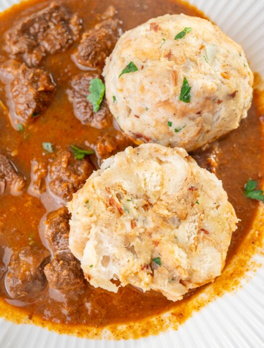 Semmelknödel served with beef goulash.