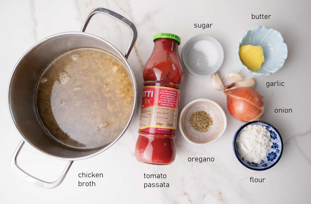 Labeled ingredients for tomato sauce to serve with meatballs.