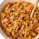 Bigos stew in a big white pot.